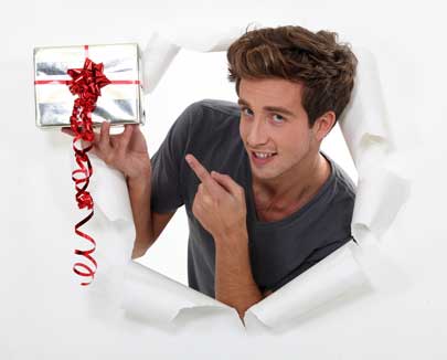 Wedding Anniversary Gifts for every year Man with an anniversary gift in his hand