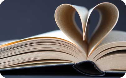 traditional anniversary symbols history Book with pages folded into a loveheart shape to represent research for the history